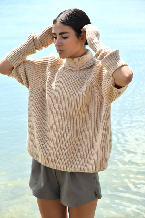 beige roll neck sweater with removable sleeves 1