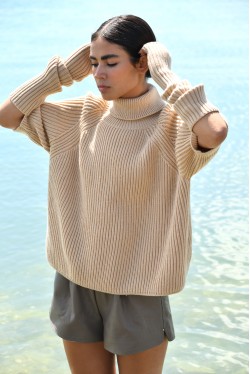 beige roll neck sweater with removable sleeves 1